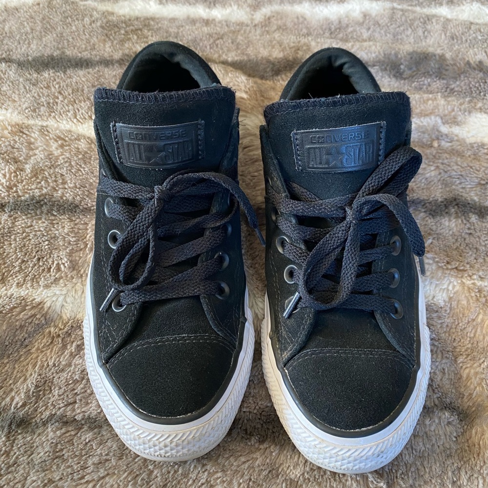 Women’s black Converse All Star sneakers